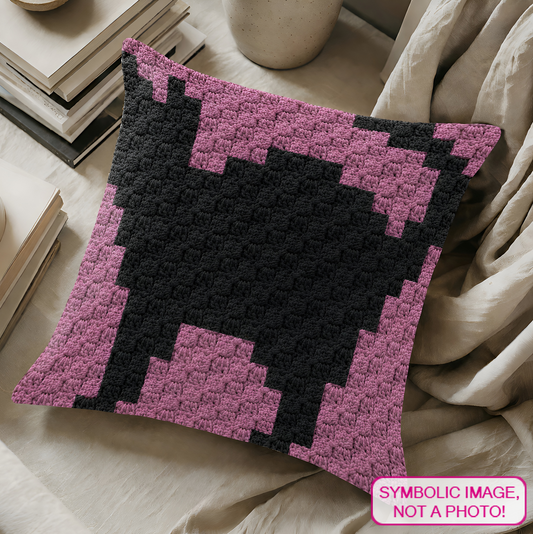 C2C crochet pillow pattern with written instructions featuring a cute black cat graph design for a handmade cat lover gift.