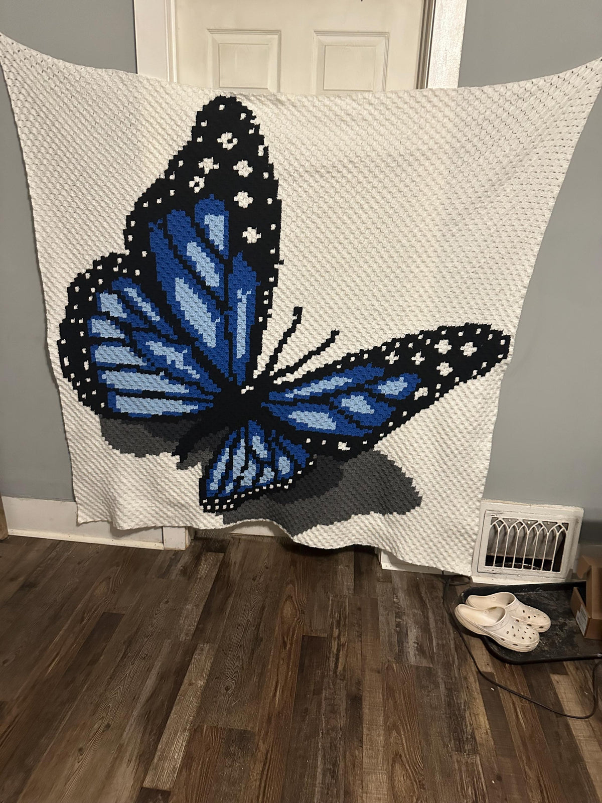 Monarch Butterfly corner-to-corner crochet blanket pattern with full-color chart and row-by-row instructions.
Crochet butterfly graphgan pattern showing a detailed monarch butterfly with orange wings, black outline, and white wing spots.