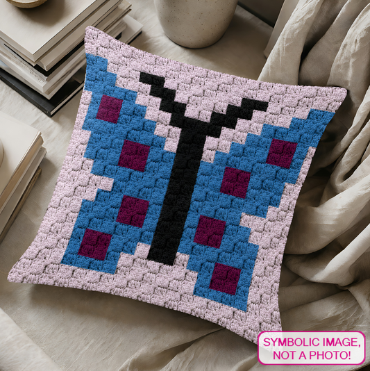 C2C crochet pillow pattern with written instructions featuring a colorful butterfly graph design for a quick handmade gift.