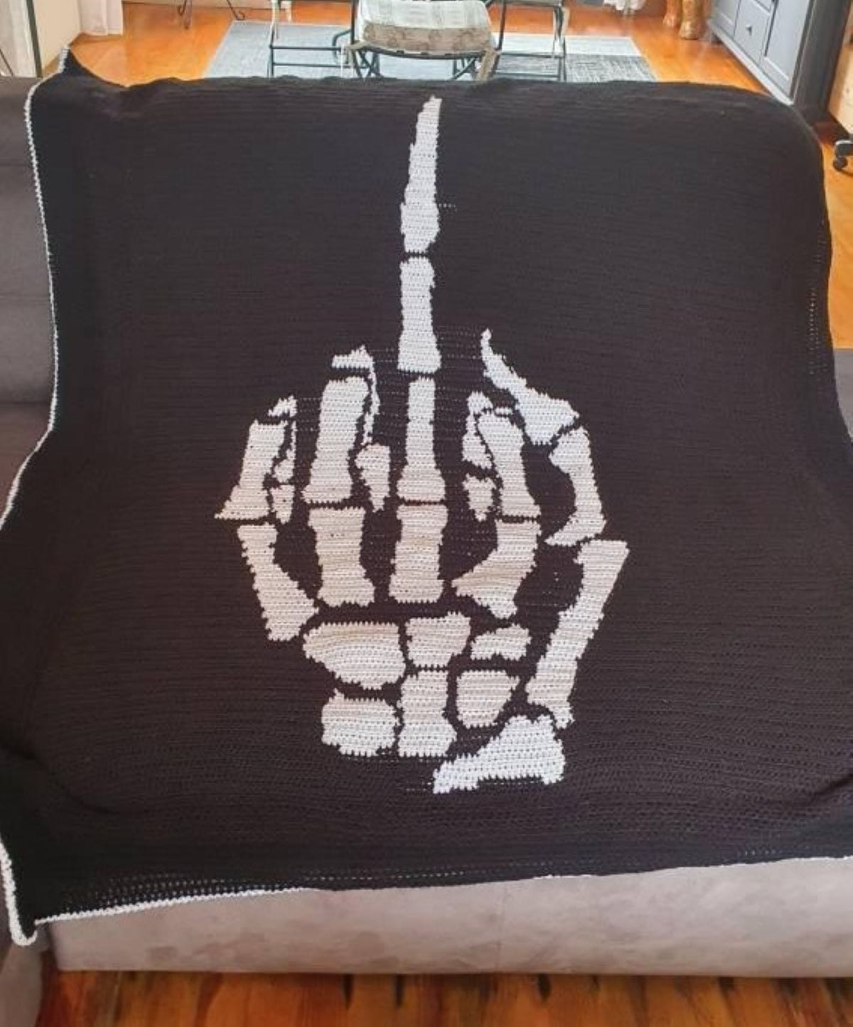 Middle Finger Skeleton Hand Crochet Pattern — a bold, funny and sassy black-and-white crochet graphgan design featuring a skeleton hand giving the middle finger. A fun choice for Halloween projects, gothic décor, sarcastic gifts and adult crochet lovers.

This digital pattern is written for Single Crochet (SC) and includes both a graph and written row-by-row instructions.