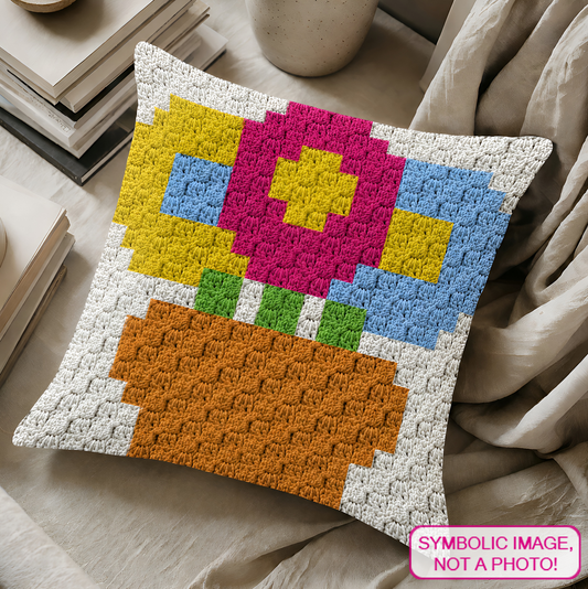C2C crochet pillow pattern with written instructions featuring a colorful flower pot graph design for a quick handmade gift.