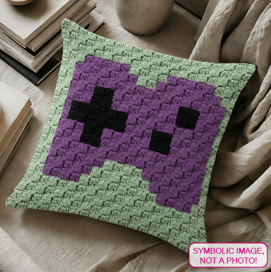 C2C crochet pillow pattern with written instructions featuring a purple video game controller graph design for a handmade gamer gift.