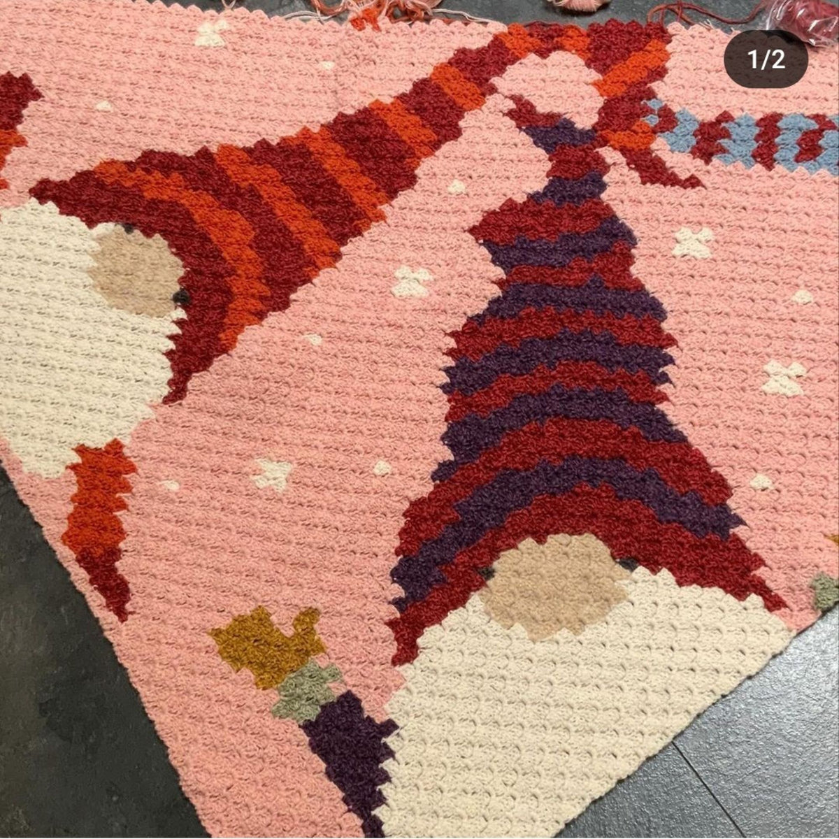 Christmas crochet blanket pattern featuring whimsical gnomes on a light blue snowy background.
C2C holiday blanket pattern with colorful Christmas gnomes and festive winter scene.