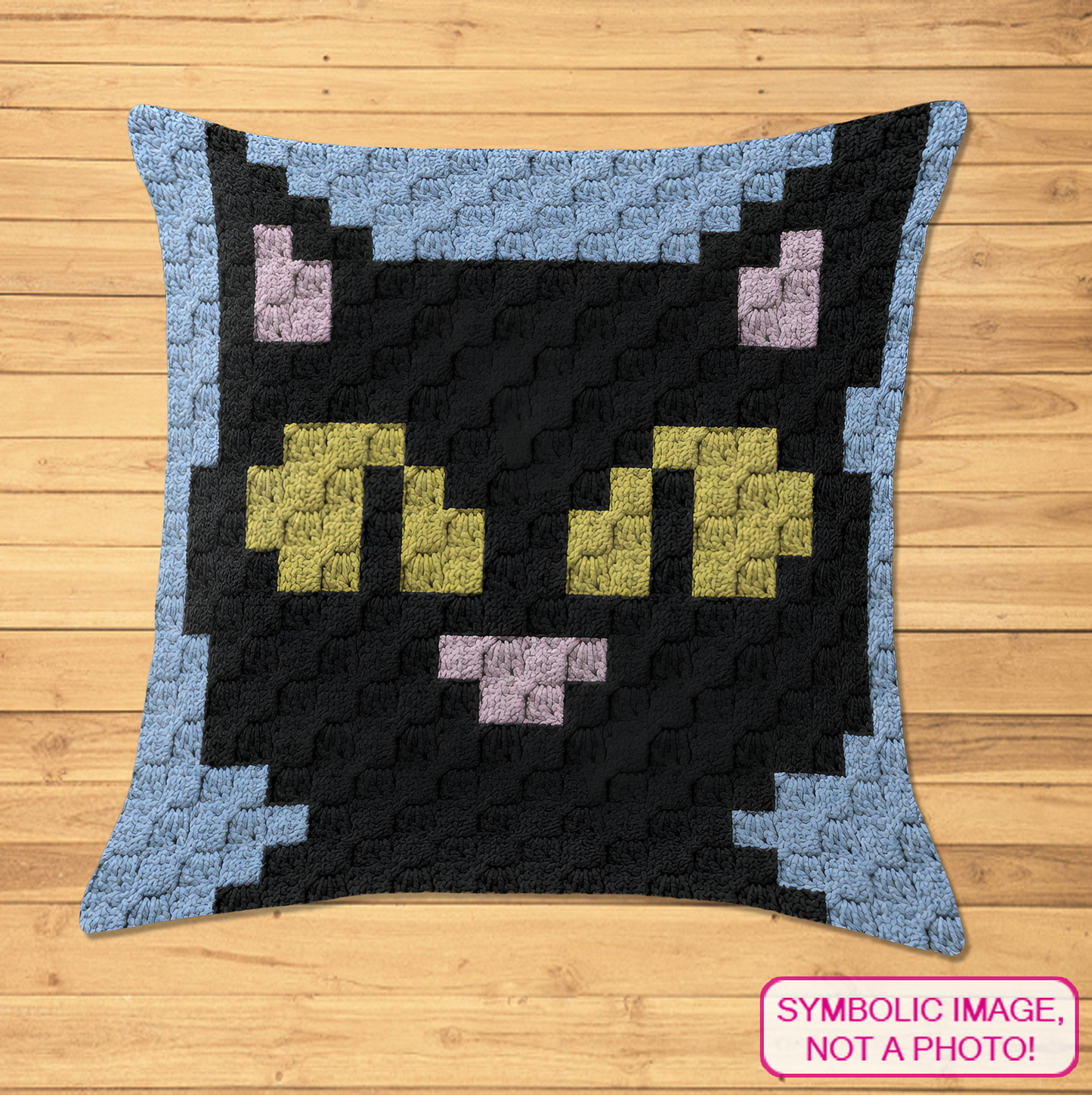 C2C crochet pillow pattern with written instructions featuring a cute black cat face graph design for a handmade cat lover gift.