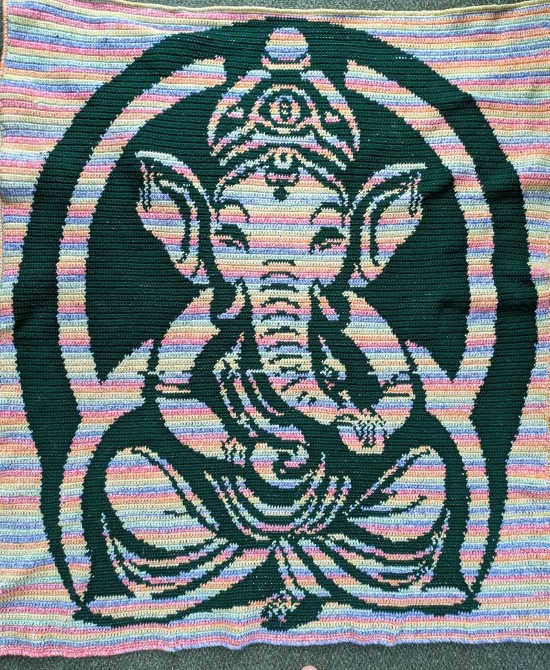 Spiritual crochet graphghan pattern featuring Lord Ganesha with written instructions.
Tapestry crochet blanket pattern with Lord Ganesha design for meditation and yoga decor.