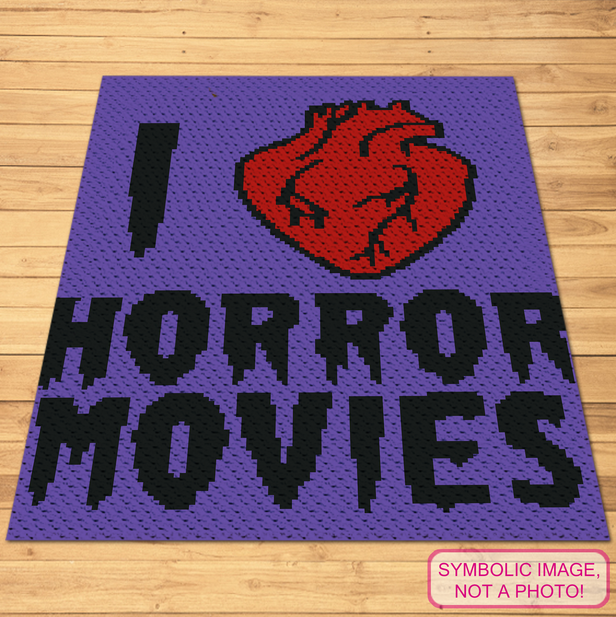 Horror Movie C2C crochet blanket pattern featuring I Love Horror Movies text and a red anatomical heart.
Corner-to-corner horror graphgan with bold black lettering, red heart, and blue background.
