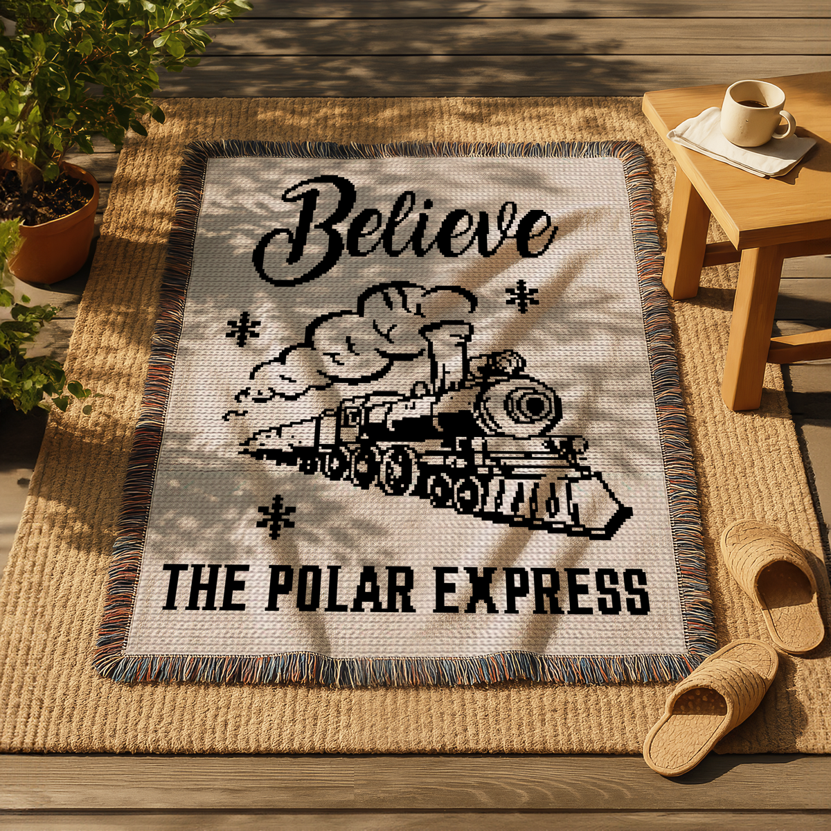 Believe Train Christmas crochet blanket pattern with black train design and Believe text