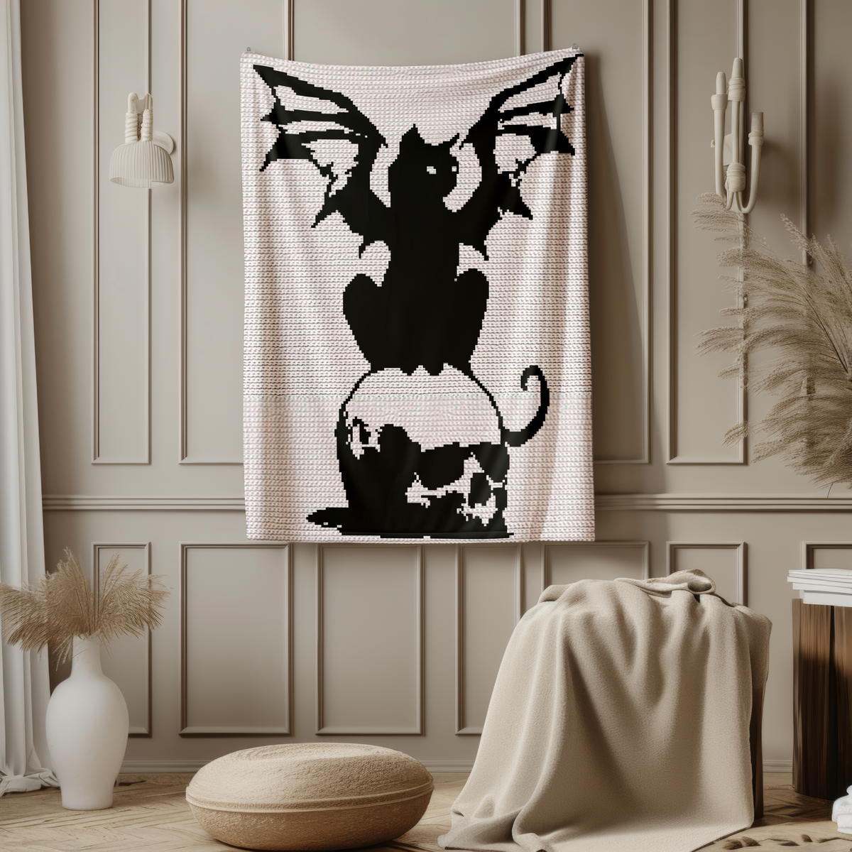 Black winged cat sitting on a skull crochet blanket pattern hanging as gothic wall decor