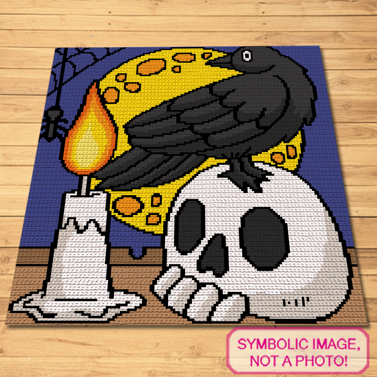 Crow and skull crochet blanket design laid flat showing gothic moon, candle and raven Halloween artwork.