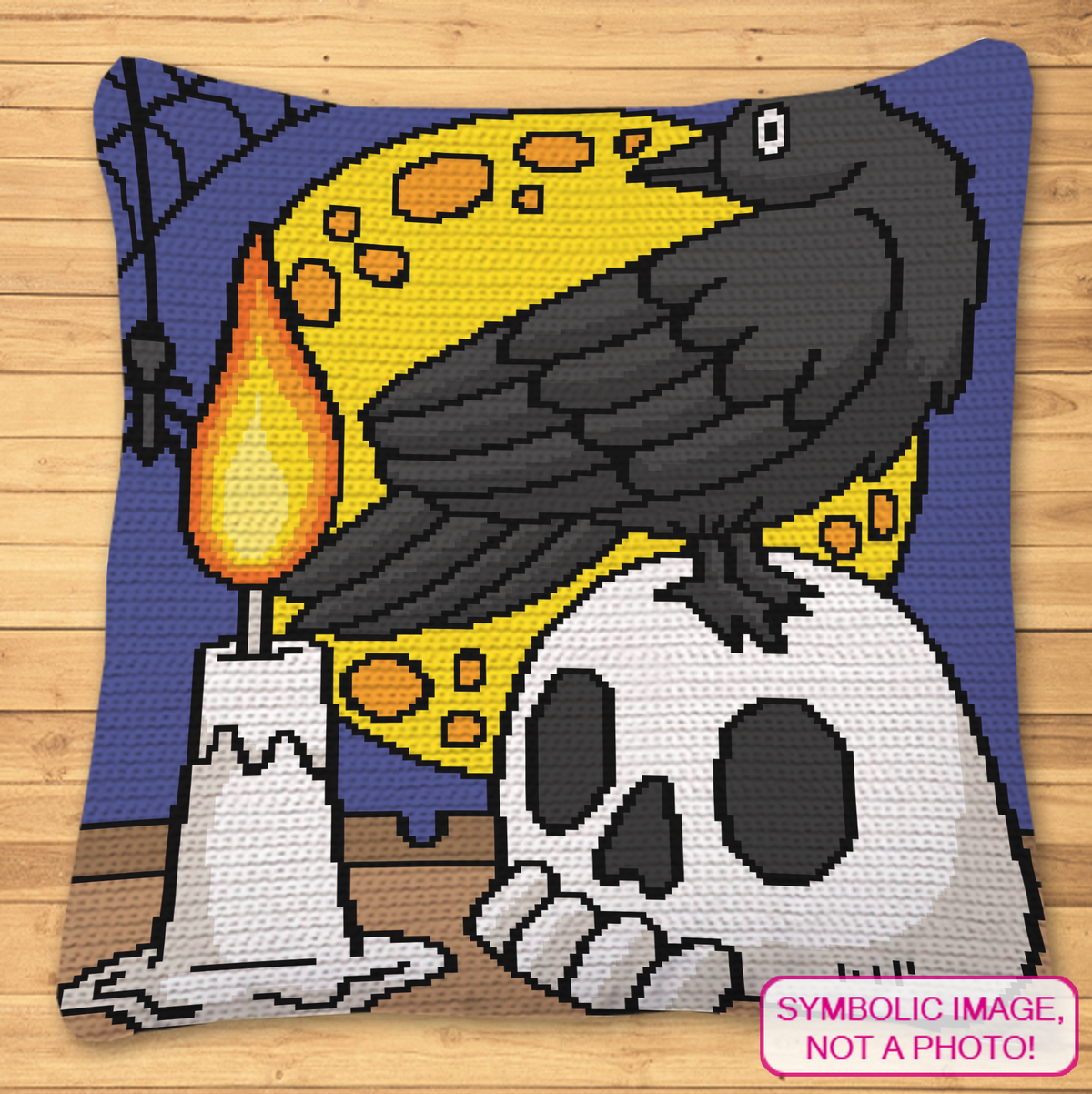 Crow on a Skull crochet pillow mockup with black raven, skull, candle and full moon gothic Halloween design.