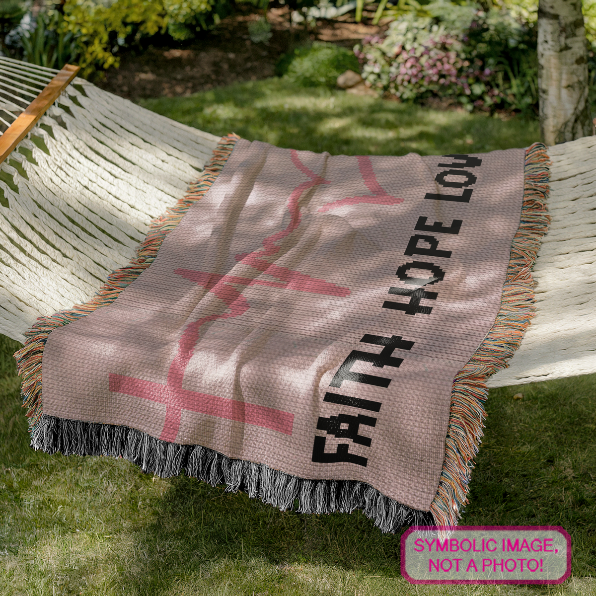 Faith Hope Love cancer awareness crochet blanket pattern displayed on a hammock with pink ribbon, heartbeat and cross design
