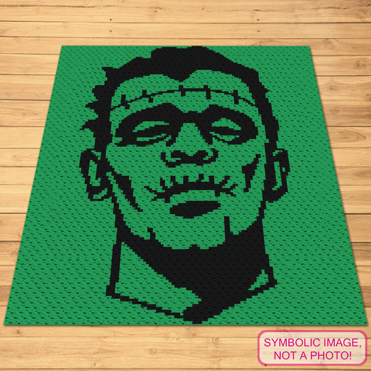 Frankenstein monster C2C crochet blanket pattern displayed with a small side table and pillows