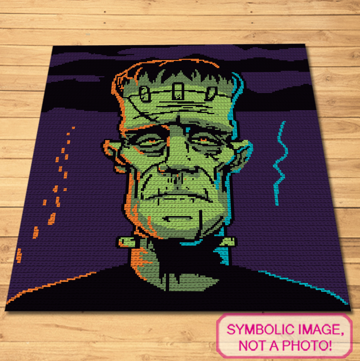 Frankenstein monster single crochet graphgan blanket pattern shown flat with bold green face and violet background.