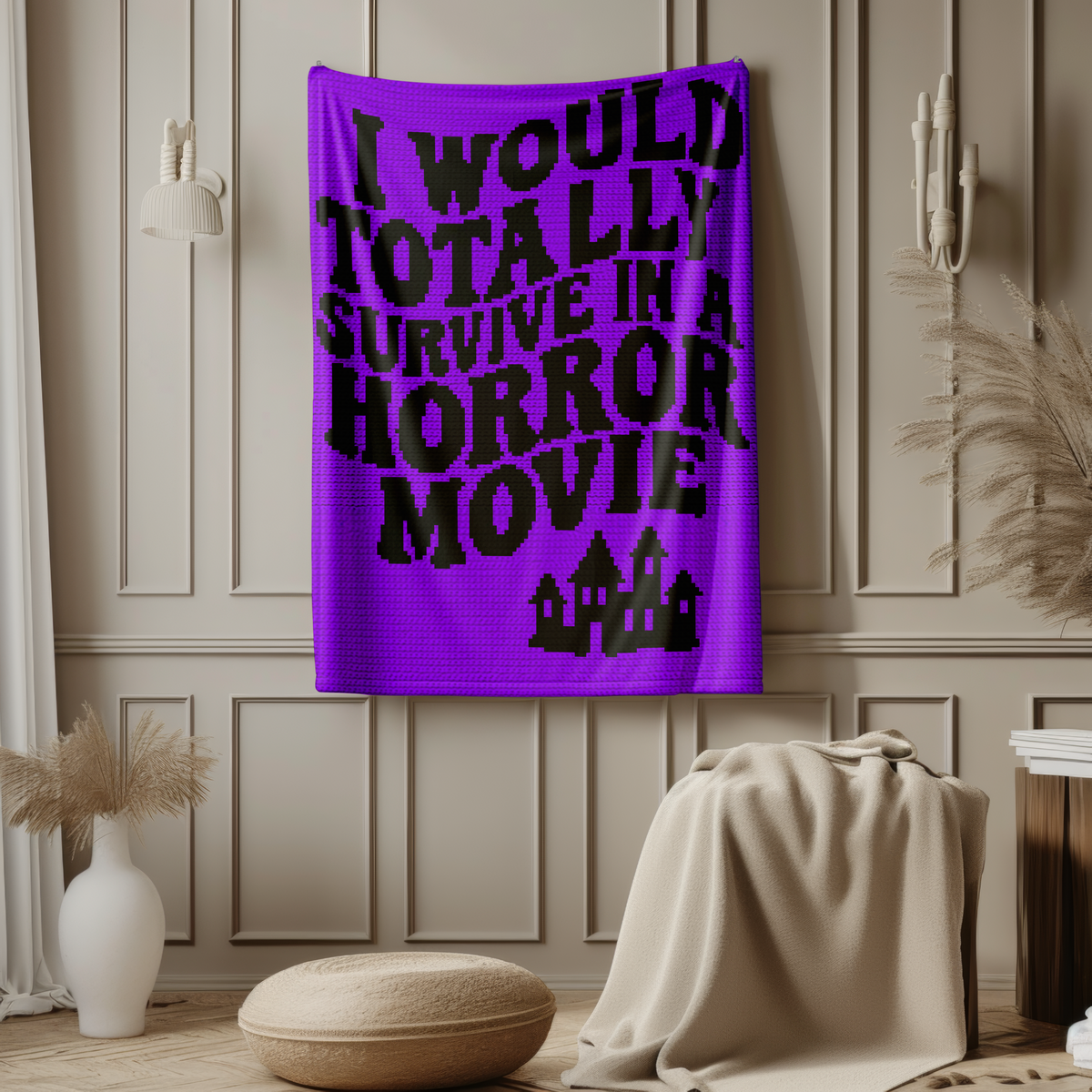 Purple and black Horror Movie tapestry crochet blanket pattern displayed on a wall