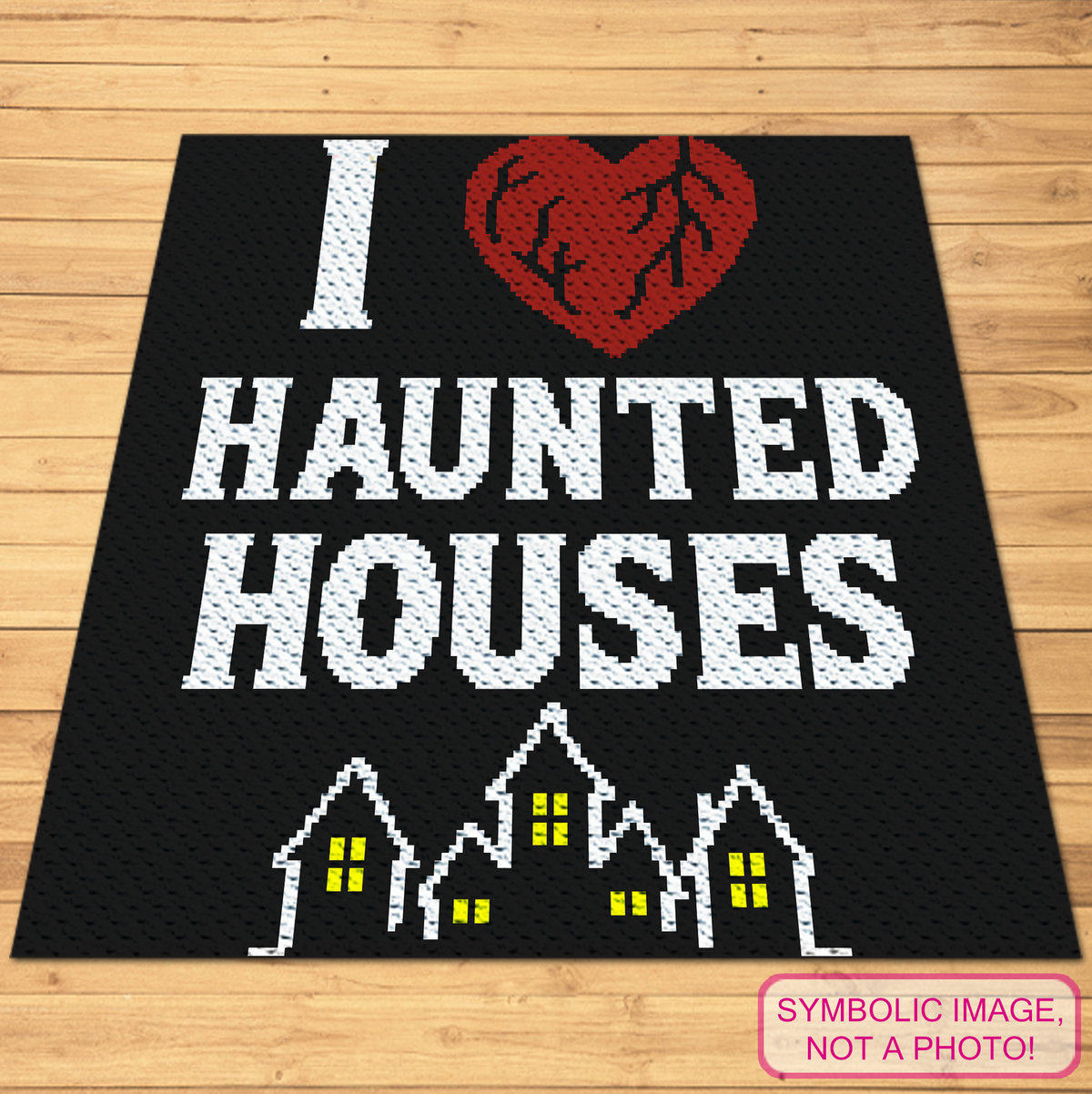 I Heart Haunted Houses C2C crochet blanket pattern with red heart, white lettering and haunted houses on a black background.