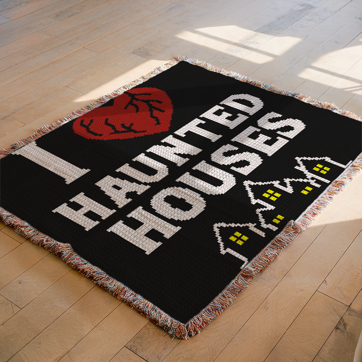Halloween C2C crochet blanket pattern featuring I Heart Haunted Houses text, a red heart and spooky house silhouettes.