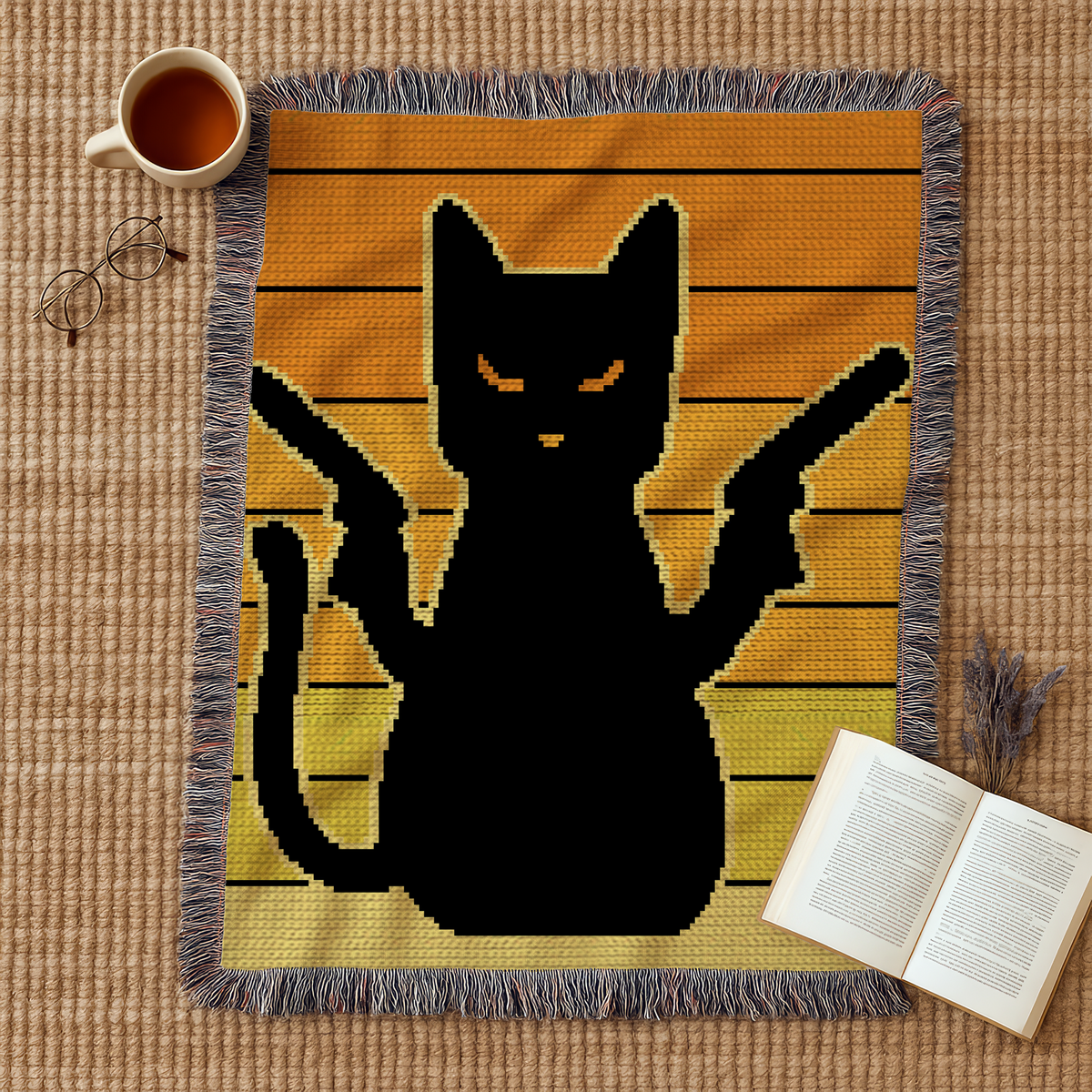 Pew Pew Cat black cat crochet blanket mockup in orange and yellow tones with raised paws.