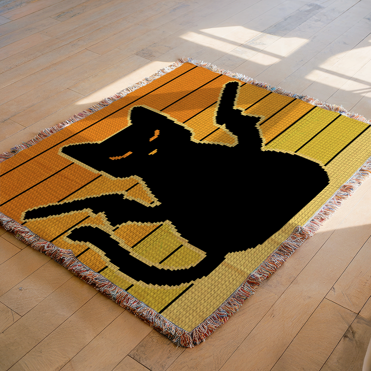 Pew Pew Cat C2C black cat crochet blanket displayed flat in a warm Halloween-inspired setting.