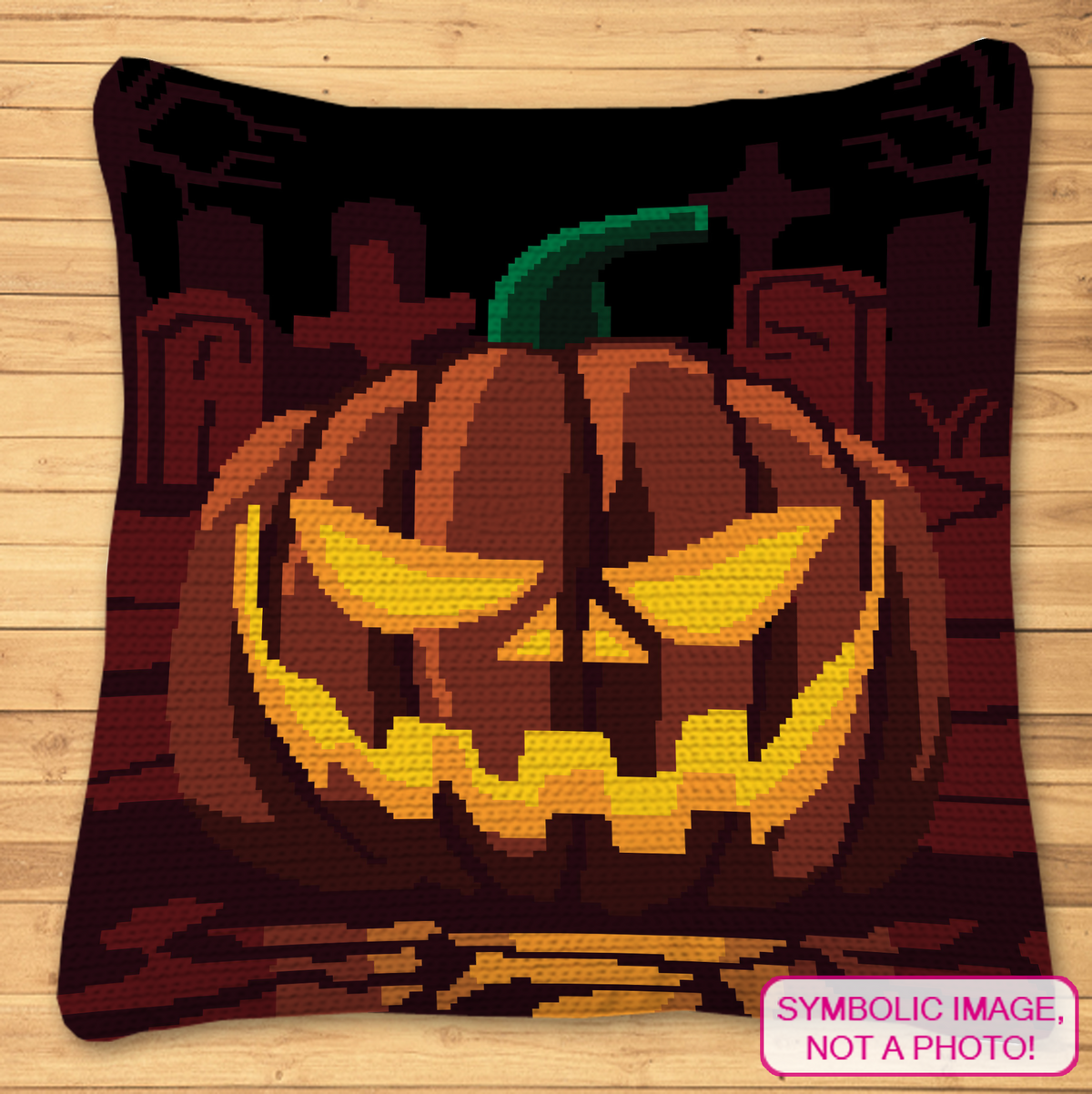 Pumpkin on a Graveyard crochet pillow mockup featuring a glowing jack-o-lantern in a dark cemetery scene.