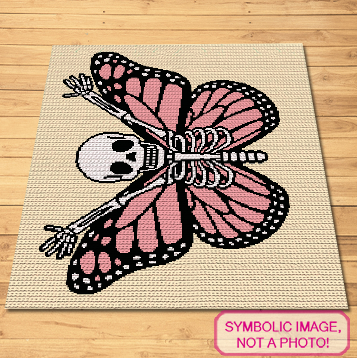Skeleton Butterfly crochet graphgan blanket shown flat with pink wings, black details, white skeleton, and pale yellow background