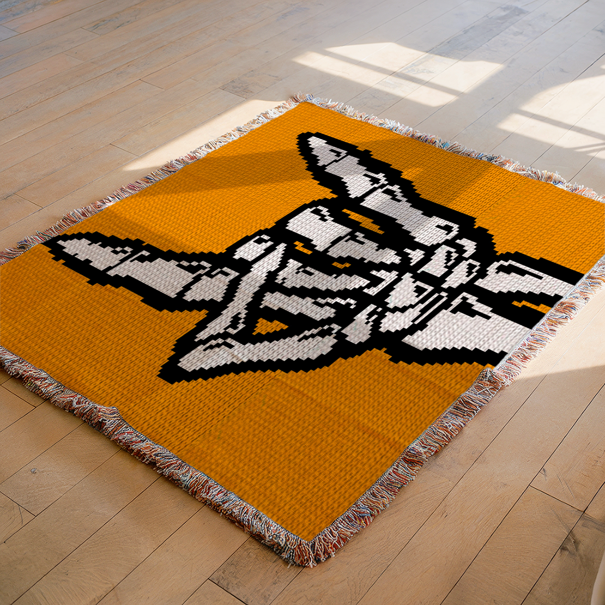 Skeleton hand Rock On crochet blanket mockup with white skeleton hand on mustard background