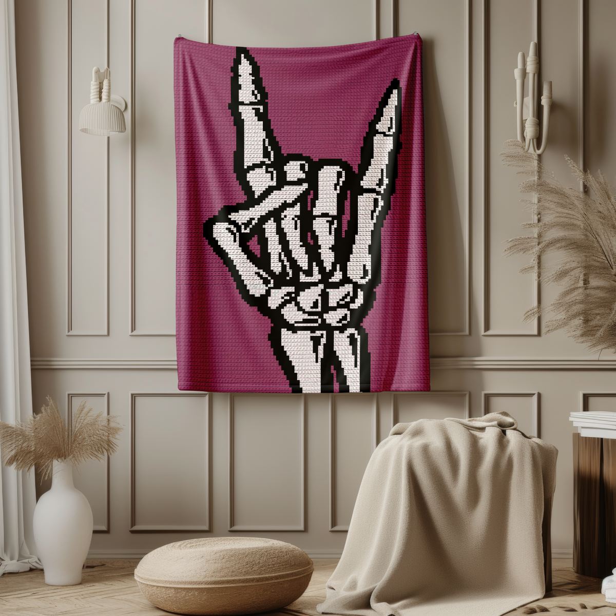 Skeleton hand Rock On crochet blanket displayed on a wall in a gothic purple colorway