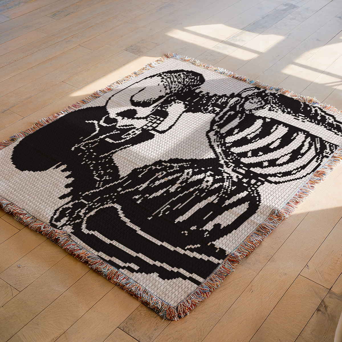 Skeleton kiss crochet blanket pattern displayed as a black and white SC graphghan on the floor