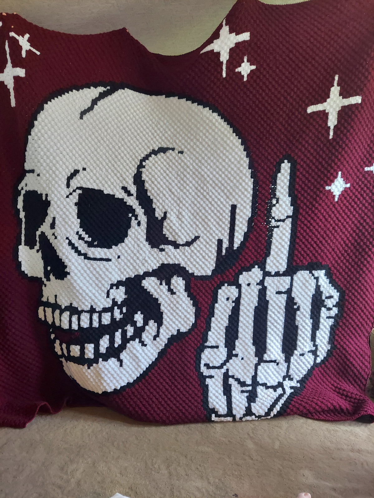 Add a bold, cheeky touch to your crochet collection with this Middle Finger Skeleton C2C Crochet Pattern. The design features a detailed skull with a raised middle finger and small star accents, making it perfect for funny adult crochet projects, gothic decor, Halloween makes, rebellious gifts, and statement blankets.