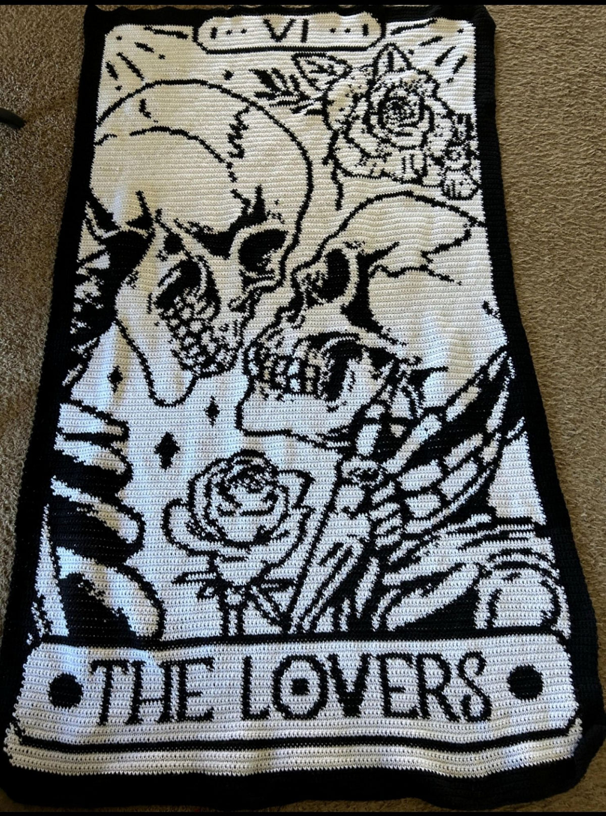 Black and cream finished The Lovers tarot card crochet blanket with gothic skull design