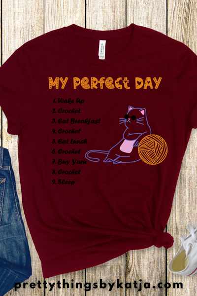 My Perfect Crochet Day is a Jersey Short Sleeve Tee. This Funny Crochet Shirt is a perfect Yarn Lover Gift. This classic unisex jersey short sleeve tee fits like a well-loved favorite. Click for more!