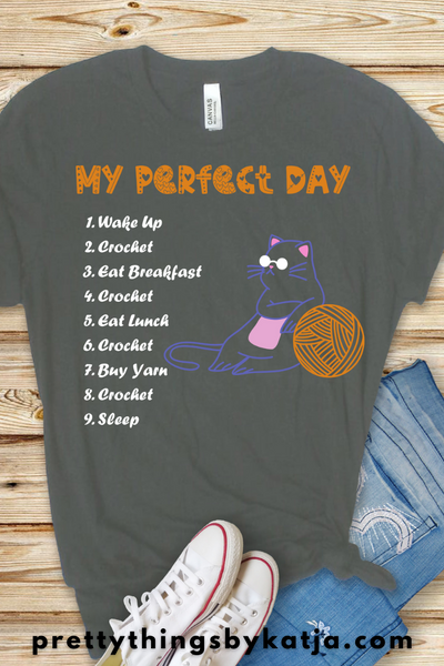 My Perfect Crochet Day is a Jersey Short Sleeve Tee. This Funny Crochet Shirt is a perfect Gift for a Crafty Woman. This classic unisex jersey short sleeve tee fits like a well-loved favorite. Click for more!