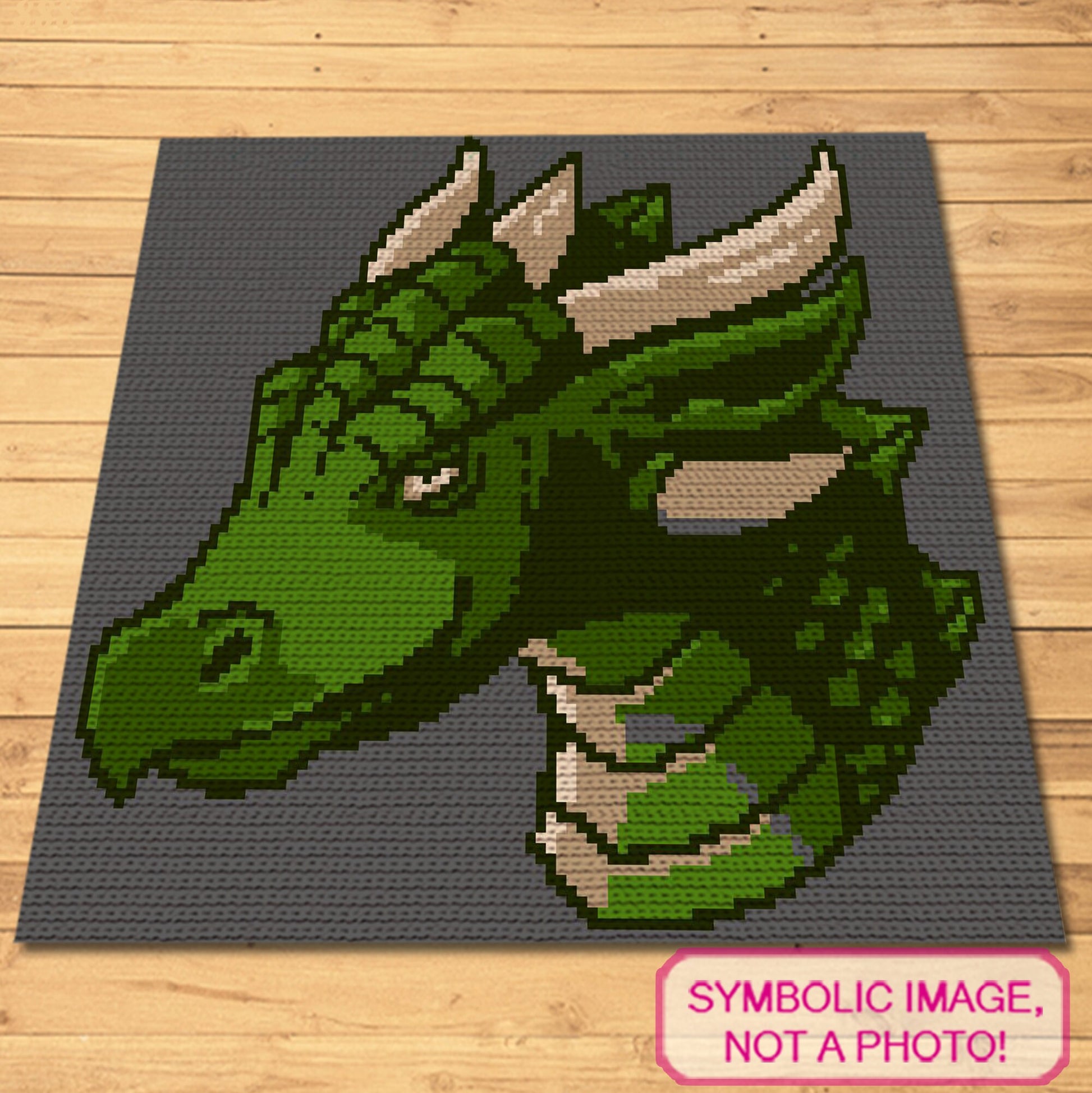Single crochet dragon graphgan pattern with a 100 x 100 color chart and written row-by-row instructions.
Green dragon crochet pillow and blanket pattern for fantasy lovers, kids’ rooms, game rooms, and handmade gifts.